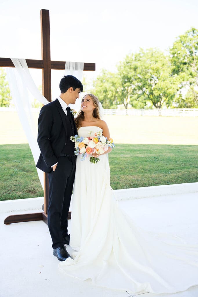 cute picture of the bride and groom smiling at each other
