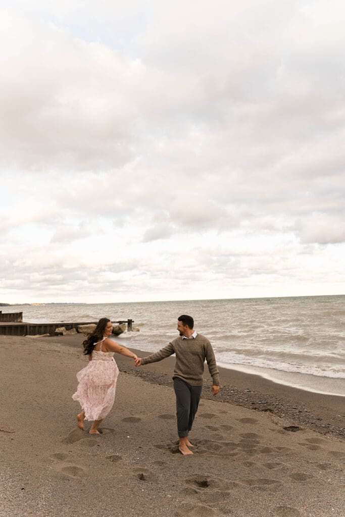 couple walking around the beach during their photoshoot