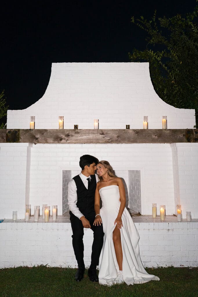 groom kissing the bride on the cheek