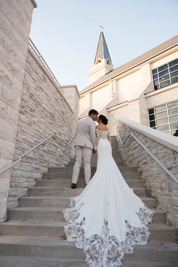 bride and groom kissing during their bridal portraits