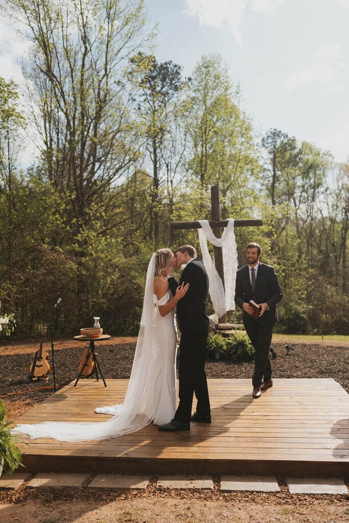 couple kissing after their wedding ceremony