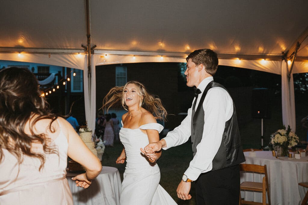 newlyweds at their fun wedding reception party