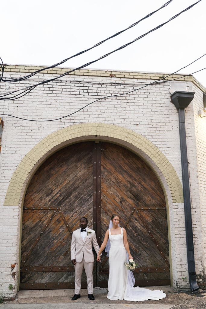cute picture of the newlyweds holding hands during their photoshoot