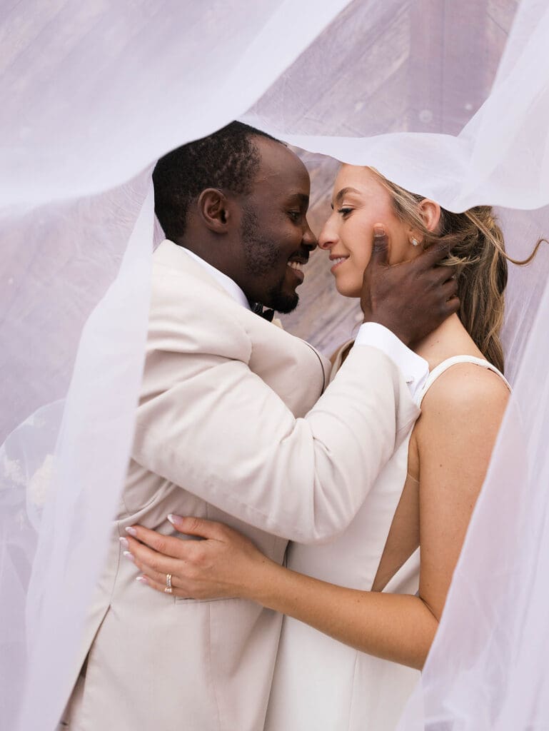 cute picture of the bride and groom smiling at each other