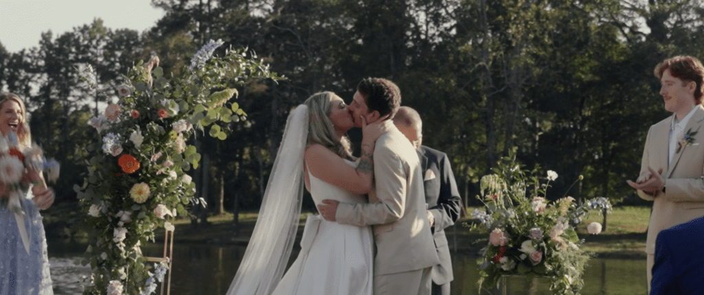 bride and groom kissing after their wedding ceremony