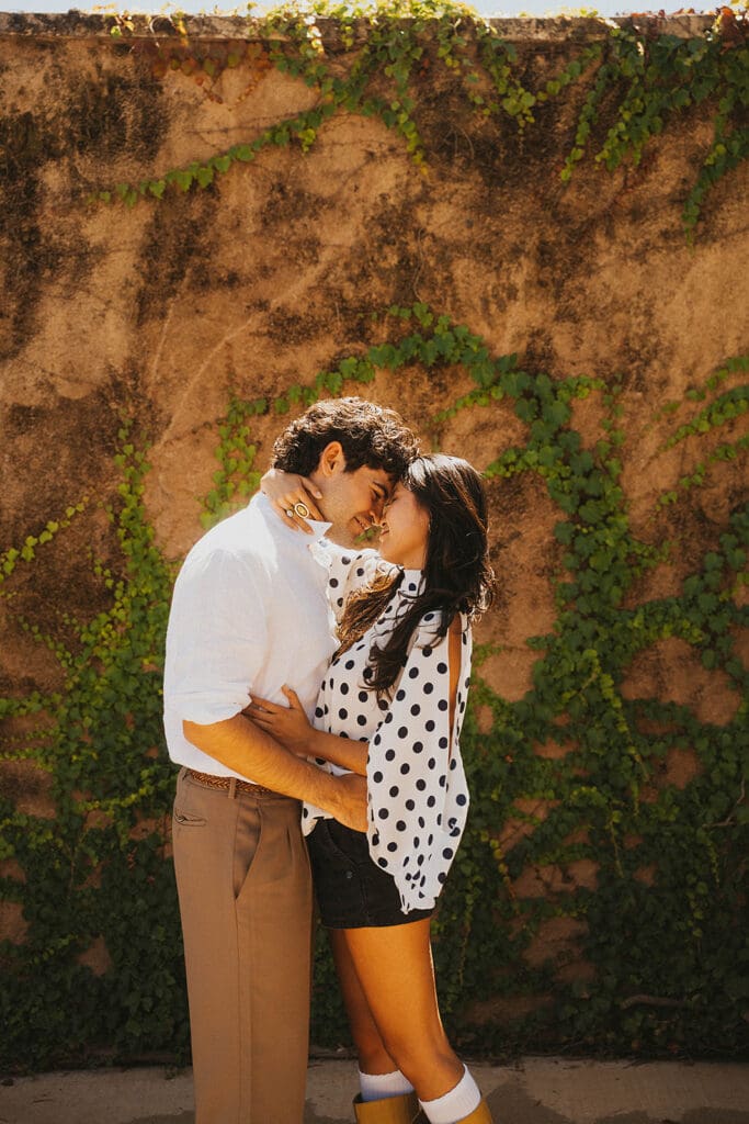 cute picture of the newly engaged couple kissing